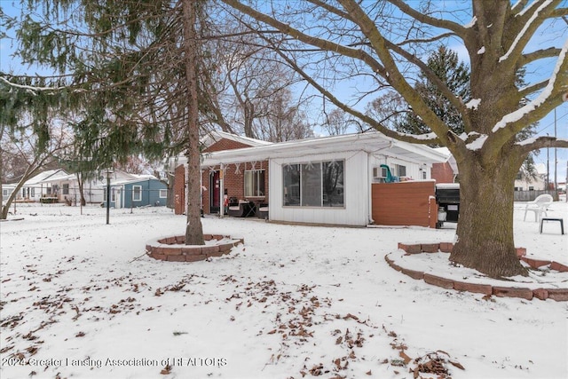 view of snow covered house