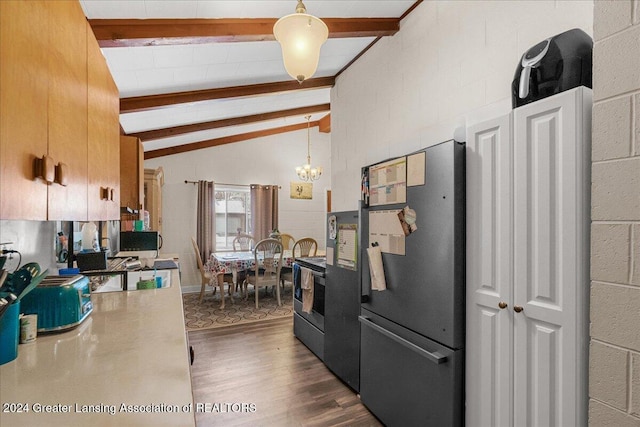 kitchen featuring pendant lighting, vaulted ceiling with beams, stainless steel appliances, and dark wood-type flooring