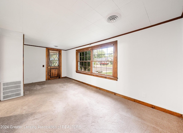 interior space with carpet flooring and crown molding