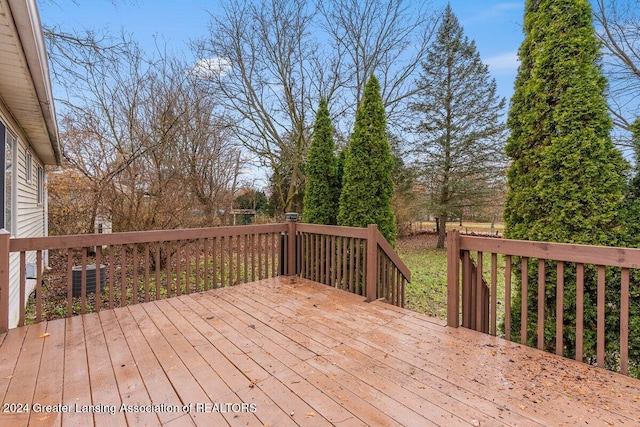 wooden terrace featuring cooling unit