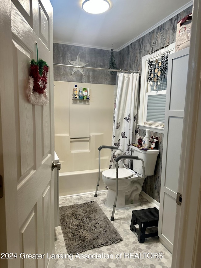 bathroom with ornamental molding, shower / bath combo, and toilet