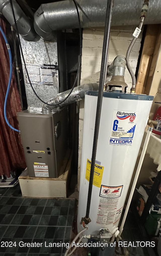 utility room featuring gas water heater