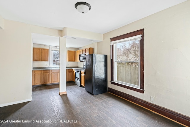 kitchen featuring dark hardwood / wood-style flooring and appliances with stainless steel finishes