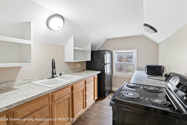 kitchen featuring light stone countertops, dark hardwood / wood-style flooring, vaulted ceiling, sink, and black appliances