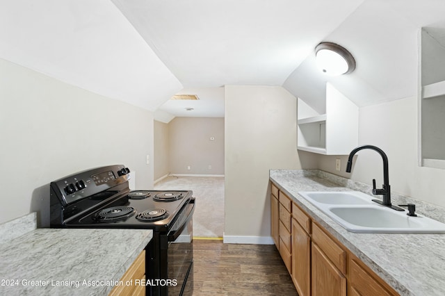 kitchen with vaulted ceiling, black / electric stove, dark wood-type flooring, and sink