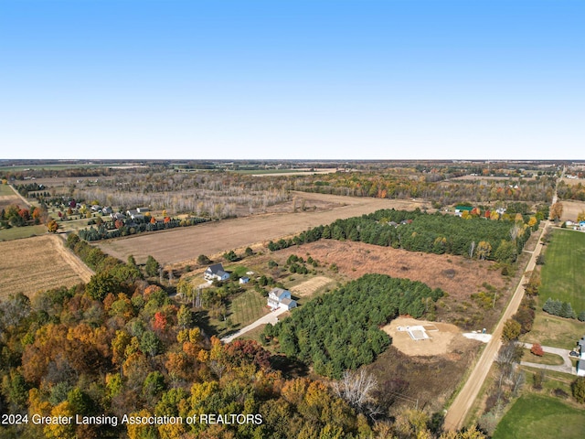 birds eye view of property with a rural view