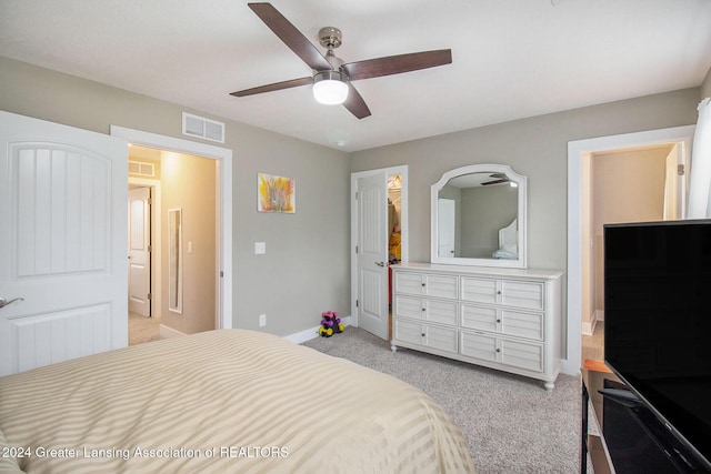 bedroom with ceiling fan and light carpet