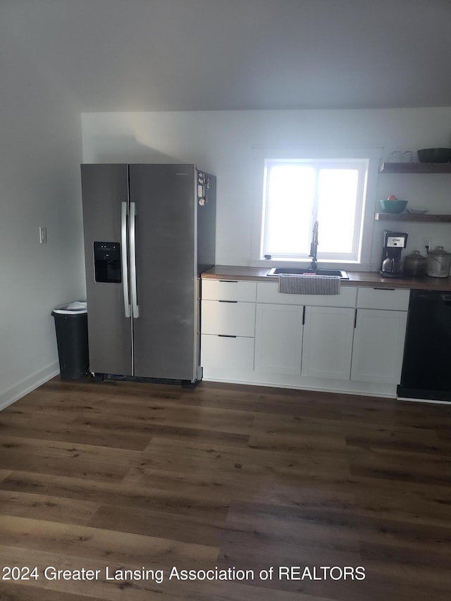 kitchen featuring stainless steel fridge, sink, dishwasher, dark hardwood / wood-style floors, and white cabinetry