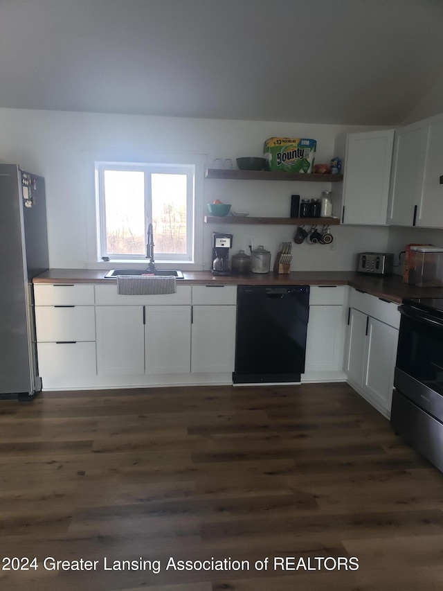 kitchen featuring appliances with stainless steel finishes, dark hardwood / wood-style flooring, white cabinetry, and sink