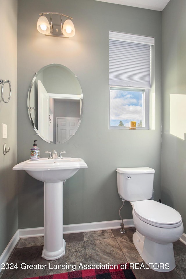 bathroom with tile patterned floors and toilet