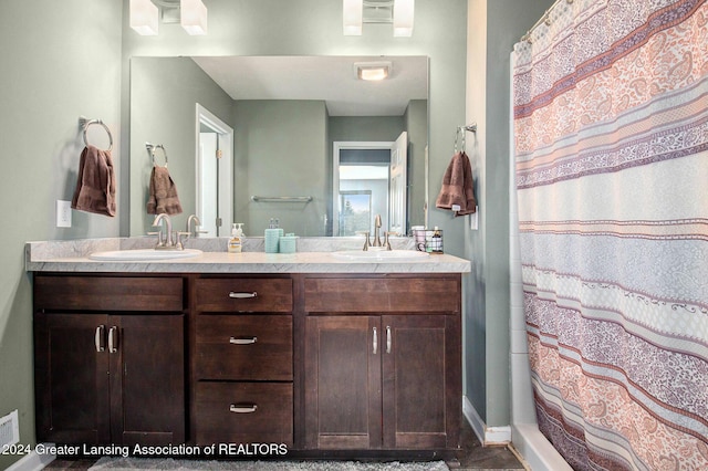 bathroom with vanity and walk in shower