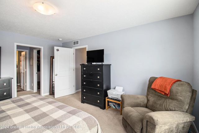 bedroom with light colored carpet