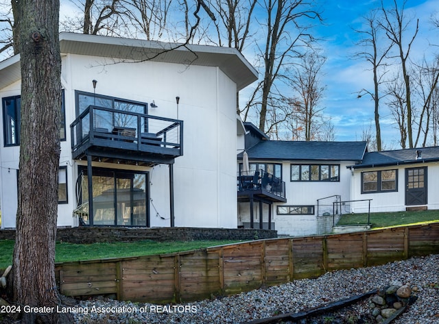 back of house with a balcony