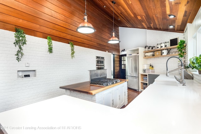 kitchen featuring kitchen peninsula, sink, appliances with stainless steel finishes, decorative light fixtures, and wood ceiling