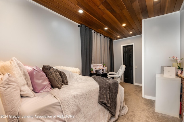 carpeted bedroom with wood ceiling and ornamental molding