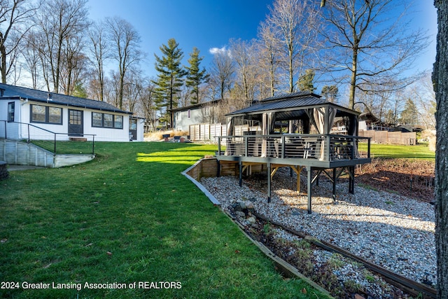 view of yard featuring a gazebo and a wooden deck