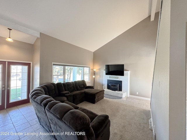 carpeted living room with high vaulted ceiling, a fireplace, and a wealth of natural light