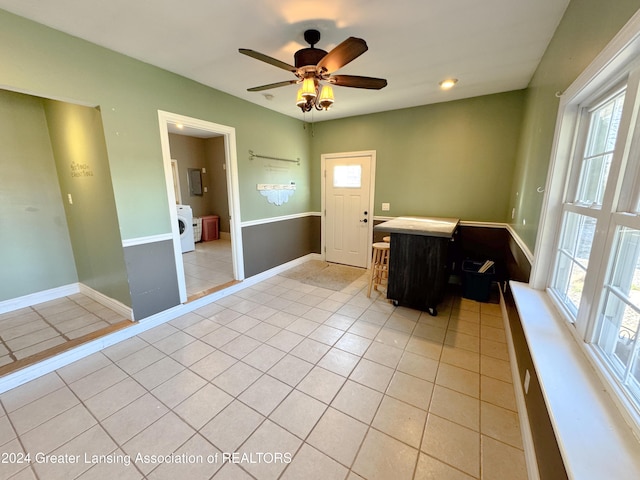 interior space with washer / dryer and ceiling fan