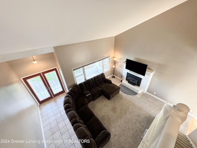 living room featuring high vaulted ceiling