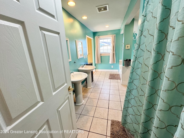 bathroom with tile patterned floors