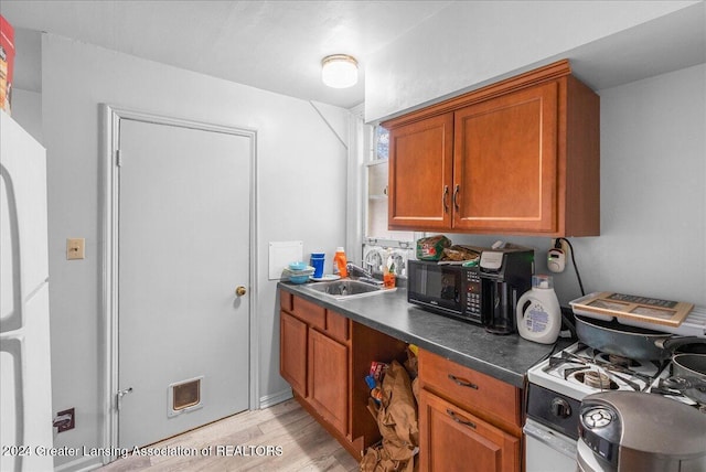 kitchen featuring gas range gas stove and sink