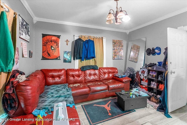 living room featuring crown molding and a chandelier