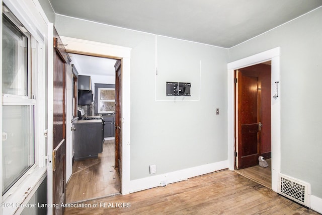 unfurnished room with light hardwood / wood-style floors