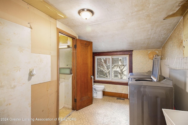 bathroom featuring separate washer and dryer