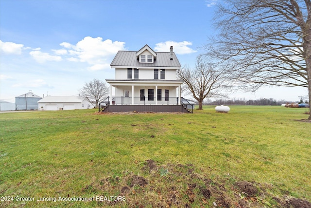 view of front facade featuring covered porch and a front yard