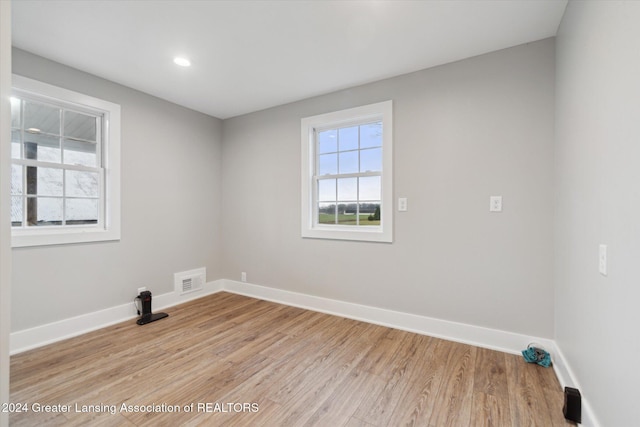 unfurnished room with light hardwood / wood-style flooring