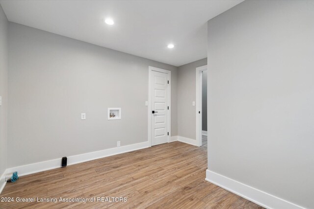 empty room with light hardwood / wood-style flooring