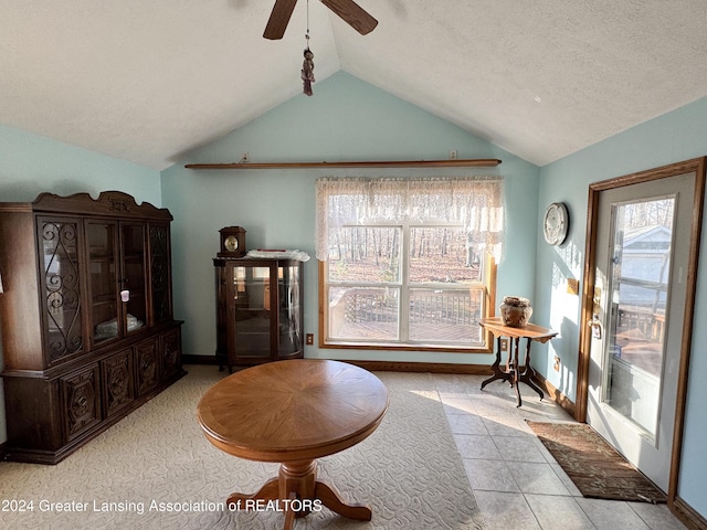 sitting room featuring a textured ceiling, vaulted ceiling, and ceiling fan