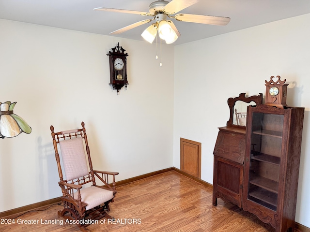 sitting room featuring ceiling fan and light hardwood / wood-style flooring