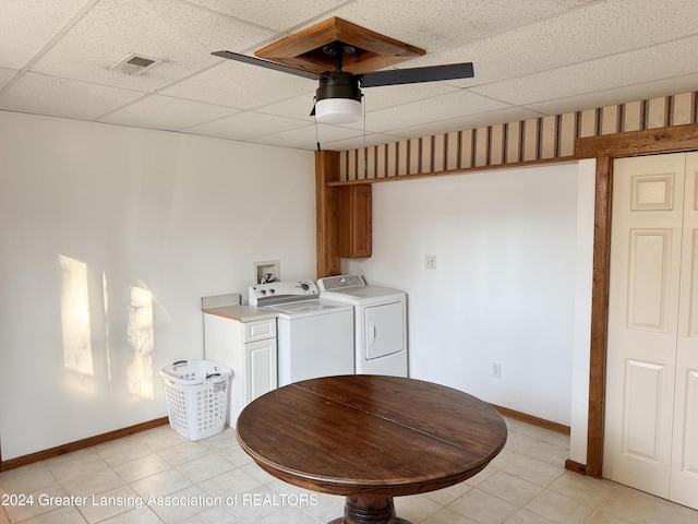 washroom with washer and dryer, ceiling fan, cabinets, and light tile patterned floors