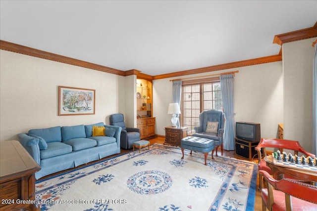 living room featuring wood-type flooring and ornamental molding