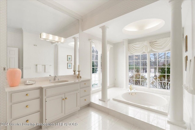 bathroom featuring tiled bath, vanity, decorative columns, and crown molding