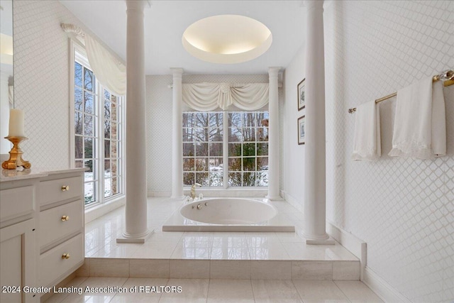 bathroom with tile patterned floors and a relaxing tiled tub