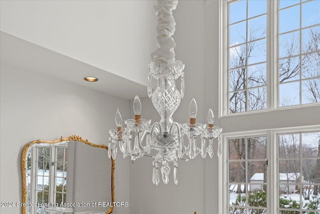 interior details featuring a chandelier