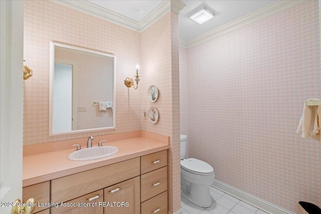 bathroom featuring tile patterned floors, vanity, toilet, and crown molding