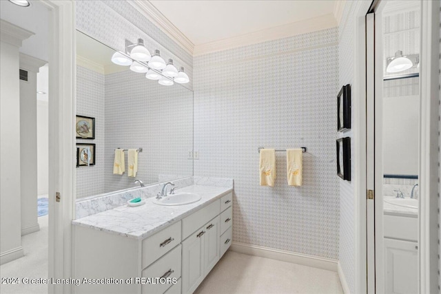 bathroom featuring crown molding and vanity