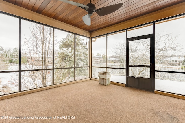 unfurnished sunroom with wooden ceiling and ceiling fan