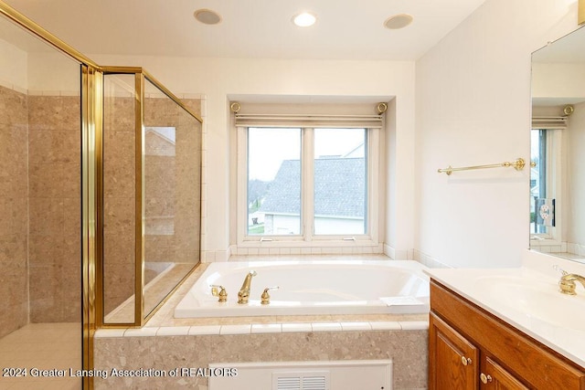 bathroom with plus walk in shower and vanity