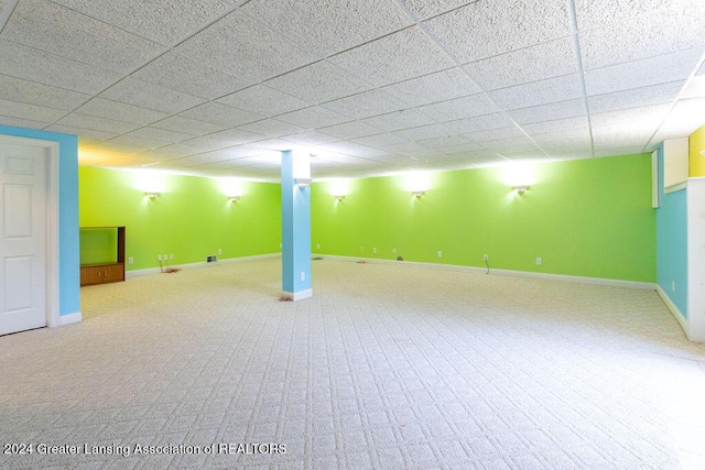 basement with carpet floors and a drop ceiling