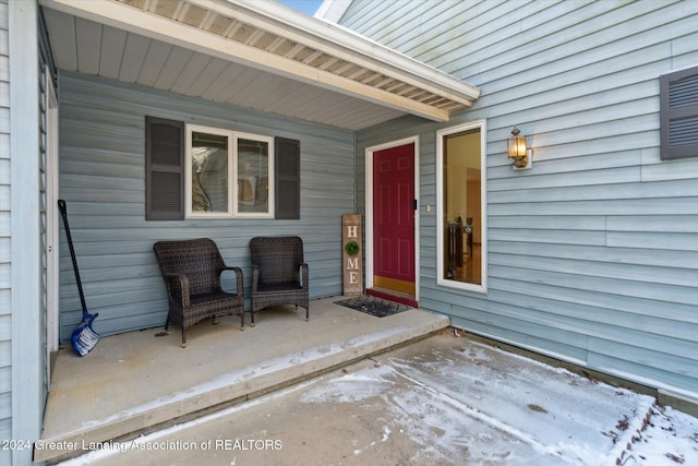 view of exterior entry featuring a porch