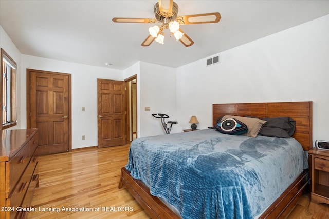 bedroom featuring light hardwood / wood-style flooring and ceiling fan