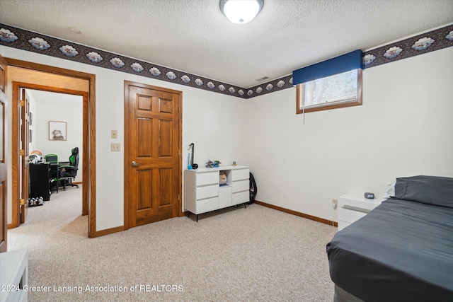 carpeted bedroom featuring a textured ceiling