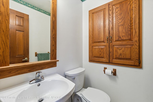 bathroom with sink and toilet