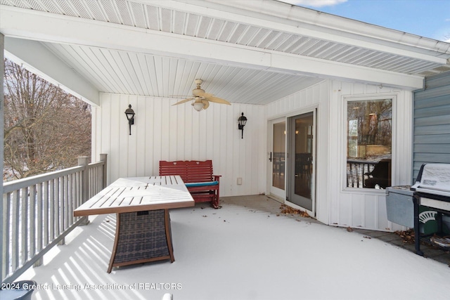 snow covered patio featuring ceiling fan