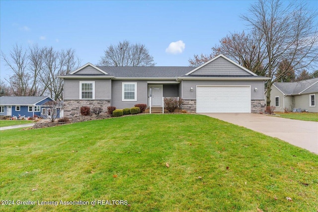 view of front facade with a front yard and a garage