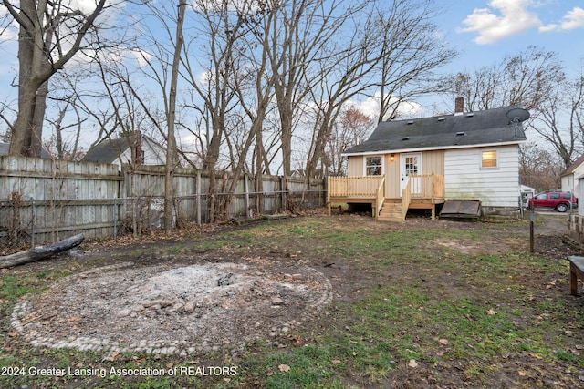 rear view of house featuring a deck